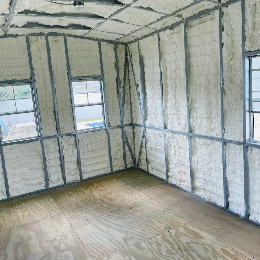 Closed-cell spray foam insulation applied to wall cavities in a residential project in Skokie